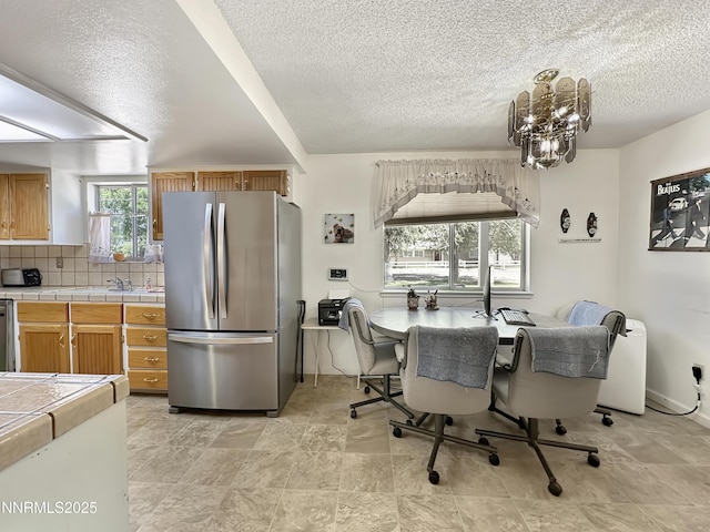 1331 Stephanie Way, Minden, NV 89423 - dining space with a textured ceiling and a chandelier