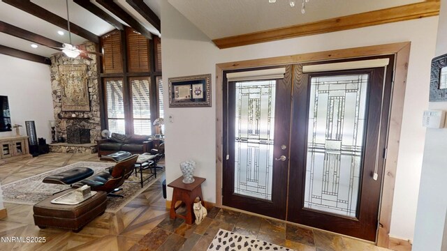 5000 Saint Andrews Dr, Reno, NV 89502 - entrance foyer with french doors, ceiling fan, baseboards, a stone fireplace, and recessed lighting