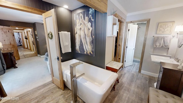 5000 Saint Andrews Dr, Reno, NV 89502 - full bathroom featuring vanity, a freestanding bath, wood finished floors, a stall shower, and crown molding