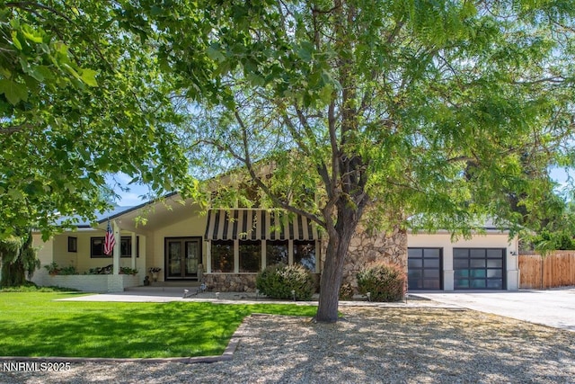 5000 Saint Andrews Dr, Reno, NV 89502 - view of front of home featuring french doors, driveway, and stone siding