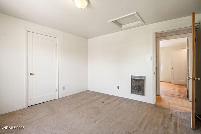 1185 Truckee Ln, Fernley, NV 89408 - spare room featuring attic access, heating unit, and carpet