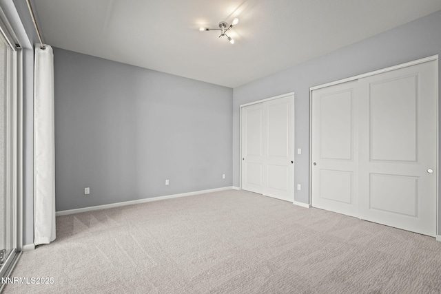 9192 Graycliff Ln, Reno, NV 89523 - unfurnished bedroom with baseboards, carpet flooring, and multiple closets