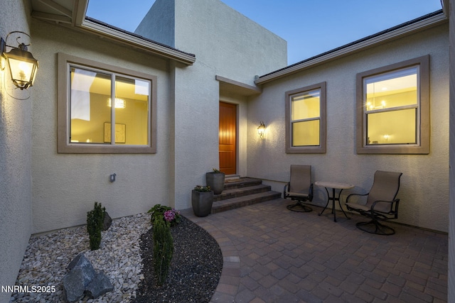 9192 Graycliff Ln, Reno, NV 89523 - view of exterior entry featuring a patio and stucco siding