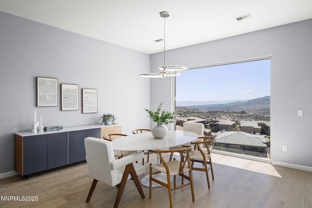 9192 Graycliff Ln, Reno, NV 89523 - dining space featuring wood finished floors, baseboards, and a mountain view