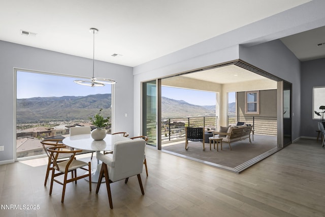 9192 Graycliff Ln, Reno, NV 89523 - dining room with a mountain view, wood finished floors, and a chandelier