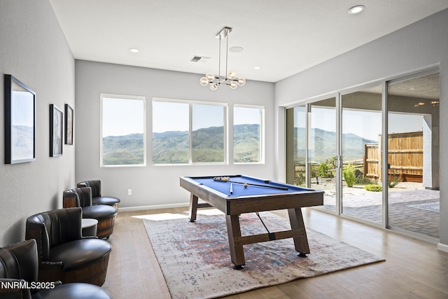 9192 Graycliff Ln, Reno, NV 89523 - rec room with a mountain view, pool table, wood finished floors, recessed lighting, and a chandelier