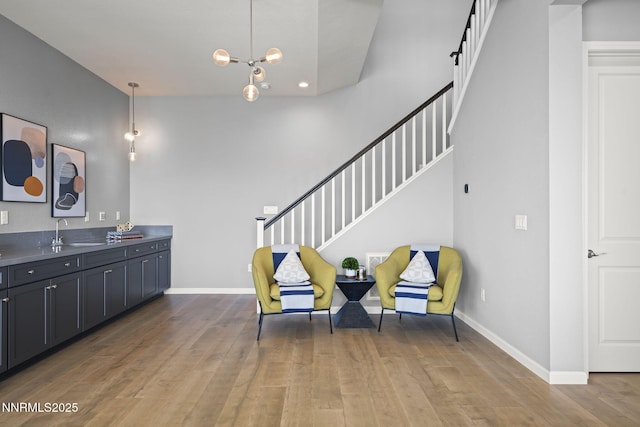9192 Graycliff Ln, Reno, NV 89523 - living area featuring stairway, wood finished floors, baseboards, recessed lighting, and a chandelier