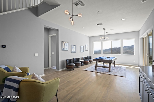 9192 Graycliff Ln, Reno, NV 89523 - recreation room featuring plenty of natural light, a chandelier, billiards table, wood finished floors, and recessed lighting