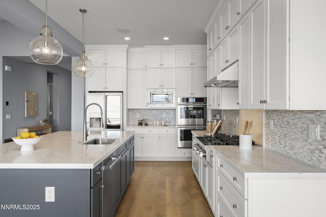 9192 Graycliff Ln, Reno, NV 89523 - kitchen featuring appliances with stainless steel finishes, a sink, under cabinet range hood, white cabinetry, and recessed lighting