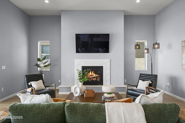 9192 Graycliff Ln, Reno, NV 89523 - living room with a premium fireplace, recessed lighting, wood finished floors, and baseboards
