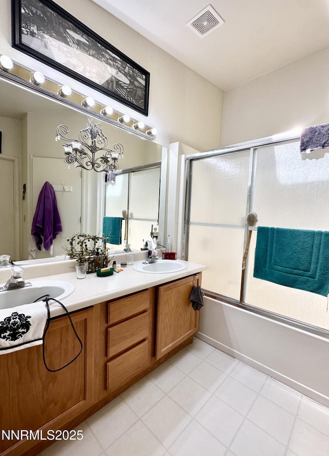 1171 White Oak Loop, Minden, NV 89423 - bathroom with double vanity, enclosed tub / shower combo, and tile patterned floors