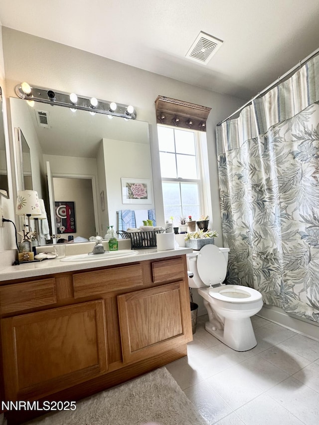 1171 White Oak Loop, Minden, NV 89423 - full bathroom featuring toilet, vanity, tile patterned flooring, and a shower with curtain