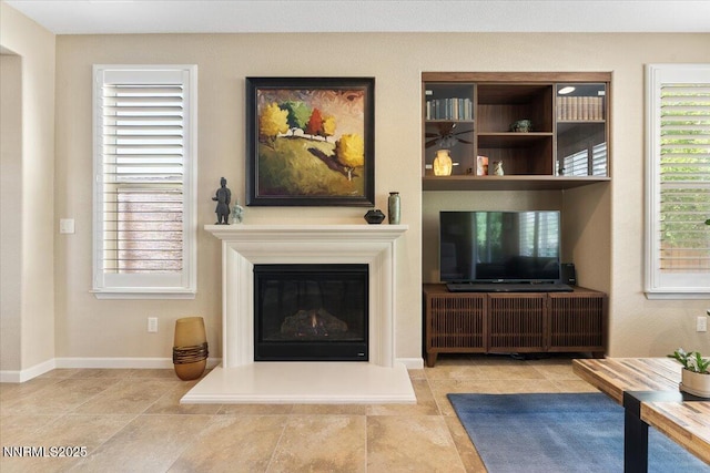 1605 W Del Webb Pkwy, Reno, NV 89523 - living room with a glass covered fireplace and baseboards