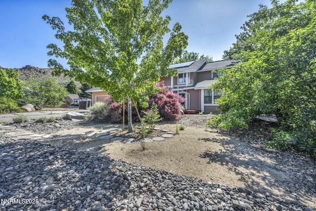 285 Lemming Dr, Reno, NV 89523 - back of property with roof mounted solar panels and a garage