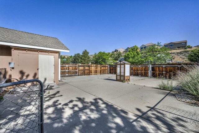 285 Lemming Dr, Reno, NV 89523 - fenced backyard with a storage shed and a patio area