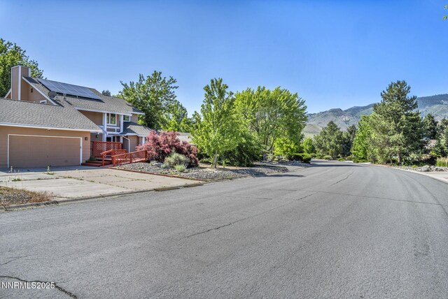 285 Lemming Dr, Reno, NV 89523 - view of asphalt road featuring a mountain view and curbs