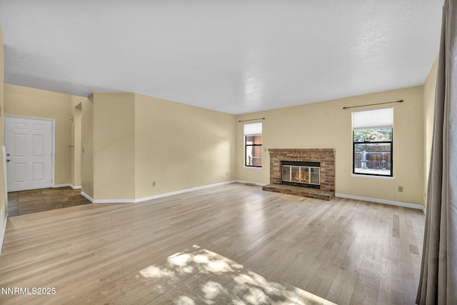 285 Lemming Dr, Reno, NV 89523 - unfurnished living room with light wood-style floors and a fireplace