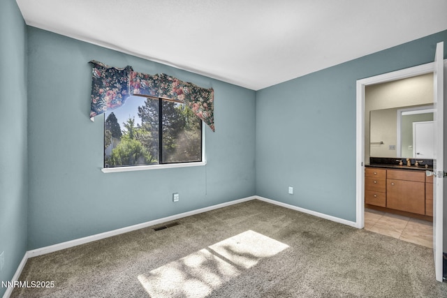 285 Lemming Dr, Reno, NV 89523 - unfurnished bedroom with light colored carpet and ensuite bathroom