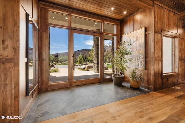 29 Bennington Ct, Reno, NV 89511 - doorway featuring wood ceiling, wooden walls, a mountain view, baseboards, and recessed lighting