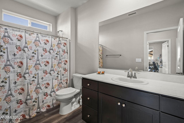 9754 Belville Dr, Reno, NV 89521 - bathroom featuring toilet, wood finished floors, vanity, and a shower with curtain