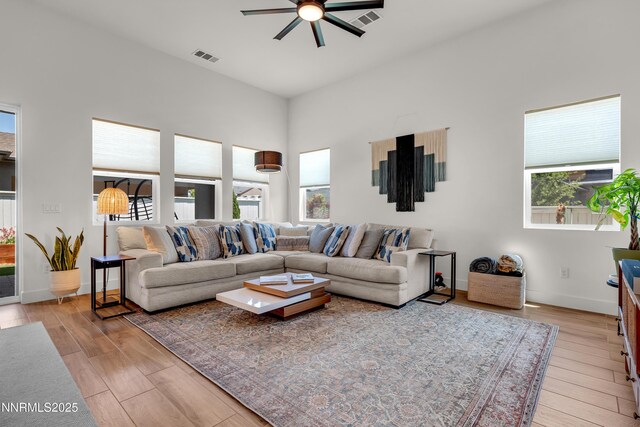 611 Camargue Trl, Reno, NV 89511 - living room featuring ceiling fan, healthy amount of natural light, and light wood finished floors