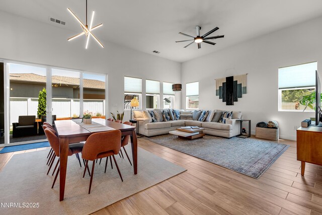 611 Camargue Trl, Reno, NV 89511 - dining area with ceiling fan, light wood finished floors, and a towering ceiling