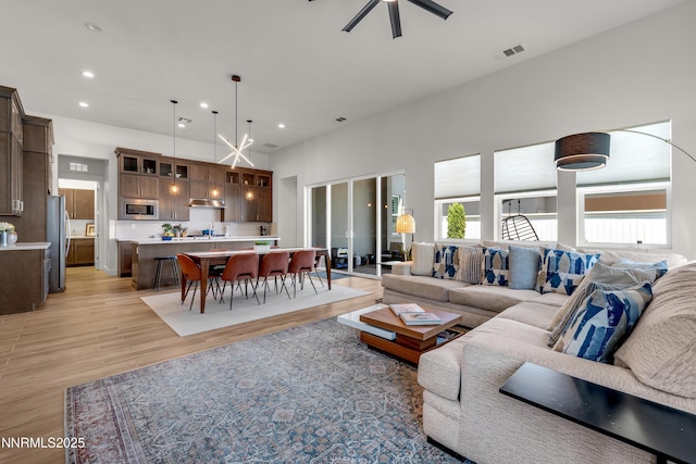 611 Camargue Trl, Reno, NV 89511 - living room featuring recessed lighting, light wood-style flooring, and a ceiling fan