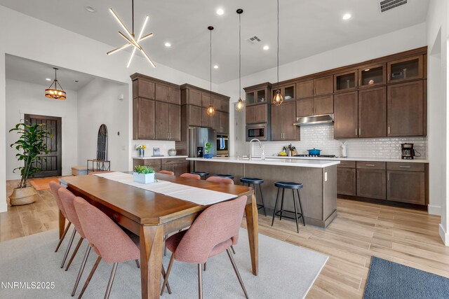 611 Camargue Trl, Reno, NV 89511 - dining space featuring light wood-type flooring and recessed lighting