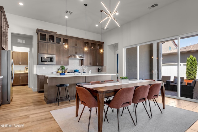611 Camargue Trl, Reno, NV 89511 - dining space with light wood finished floors and recessed lighting