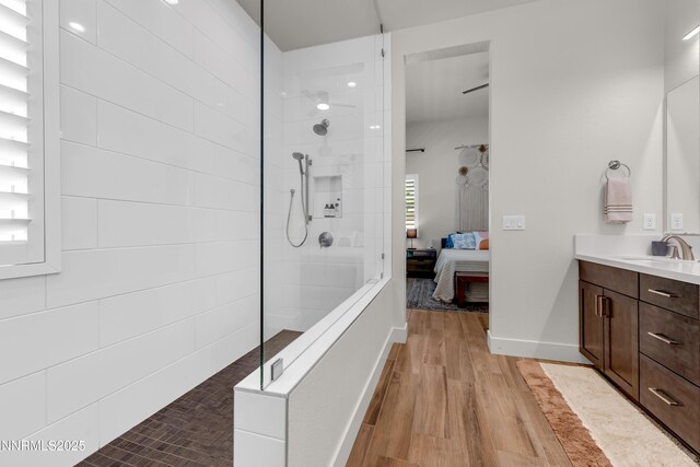 611 Camargue Trl, Reno, NV 89511 - ensuite bathroom with vanity, a walk in shower, wood finished floors, and baseboards