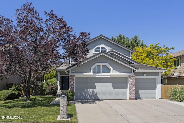 6055 Stonecreek Dr, Reno, NV 89511 - view of front of home featuring driveway, a tiled roof, and an attached garage