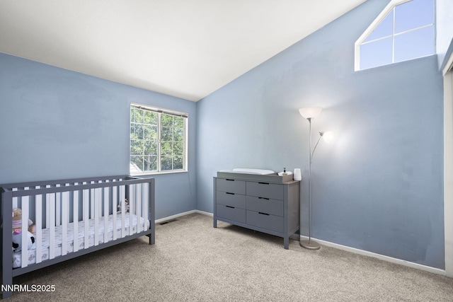 6055 Stonecreek Dr, Reno, NV 89511 - bedroom featuring lofted ceiling, carpet floors, and a nursery area