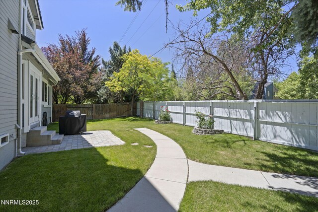 6055 Stonecreek Dr, Reno, NV 89511 - fenced backyard with entry steps and a patio area