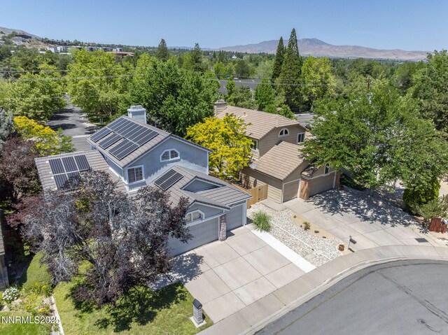 6055 Stonecreek Dr, Reno, NV 89511 - view of subject property with mountains and a heavily wooded area