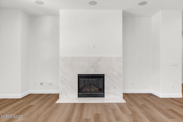 9740 Cardigan Bay Ln, Reno, NV 89521 - detailed view of a high end fireplace and wood finished floors