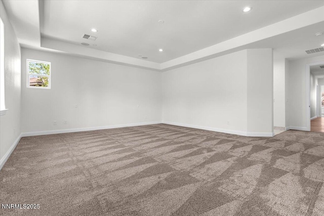 9740 Cardigan Bay Ln, Reno, NV 89521 - carpeted empty room with a tray ceiling and recessed lighting