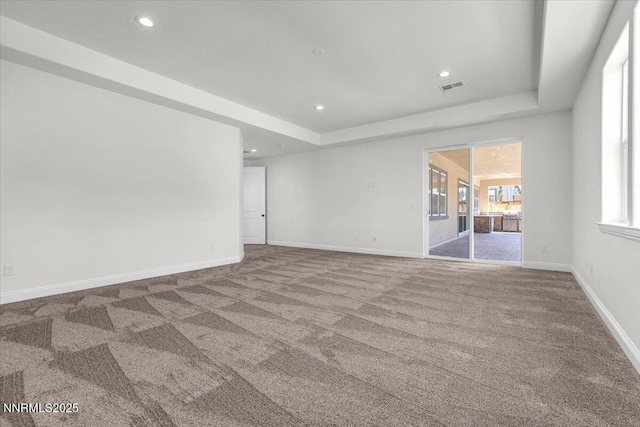 9740 Cardigan Bay Ln, Reno, NV 89521 - carpeted spare room with a tray ceiling and recessed lighting