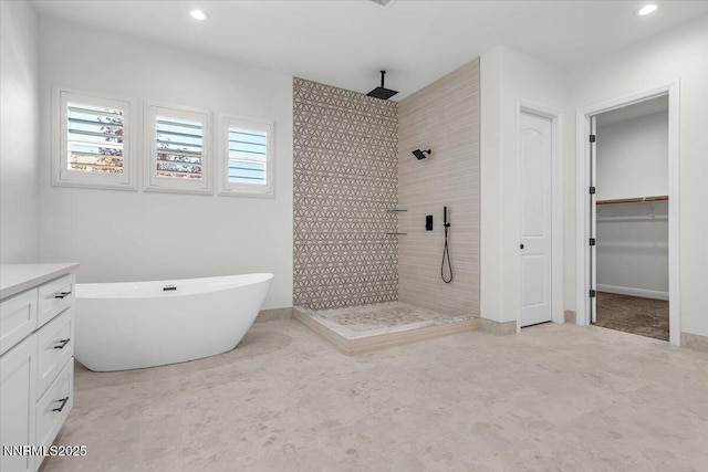 9740 Cardigan Bay Ln, Reno, NV 89521 - bathroom with tiled shower, a soaking tub, recessed lighting, and vanity