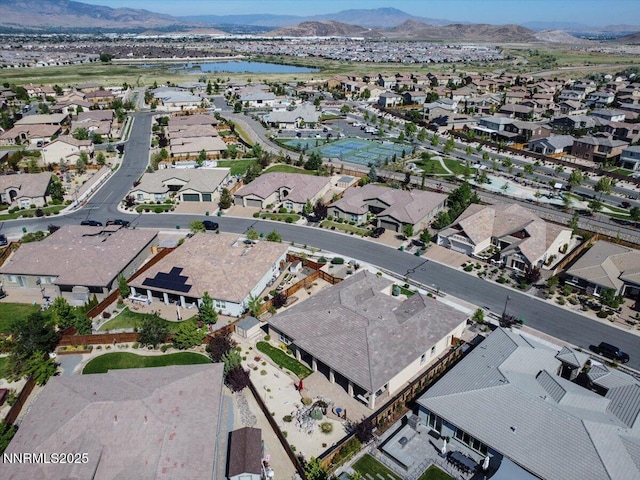 9740 Cardigan Bay Ln, Reno, NV 89521 - aerial view of property's location featuring nearby suburban area and a water and mountain view