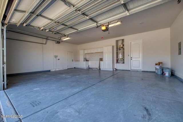 9740 Cardigan Bay Ln, Reno, NV 89521 - garage with a garage door opener, water heater, and electric panel
