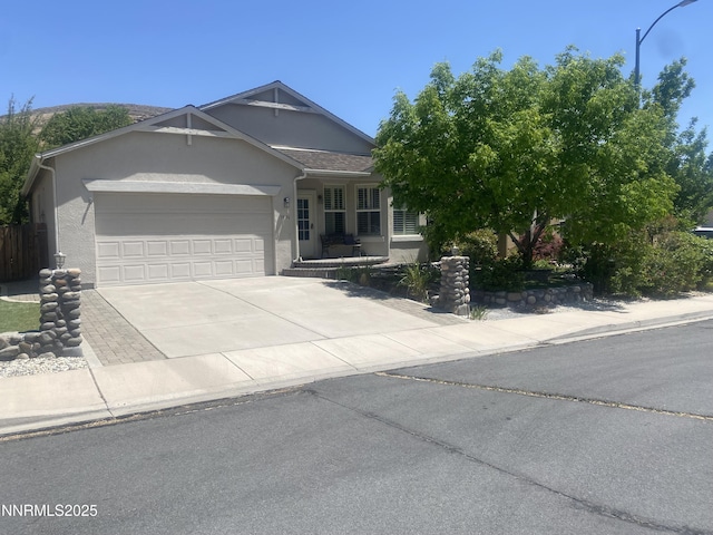 3956 Cloverbrook Dr, Sparks, NV 89436 - view of front of home featuring a garage, stucco siding, and concrete driveway