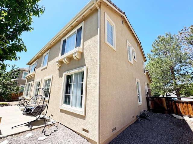6726 Runnymede Dr, Sparks, NV 89436 - view of property exterior featuring a patio area, stucco siding, and crawl space