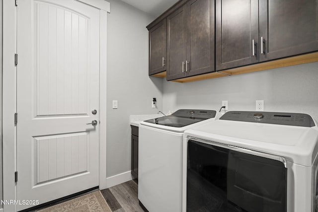 1661 Buttonwillow St, Minden, NV 89423 - washroom featuring cabinet space, separate washer and dryer, wood finished floors, and baseboards