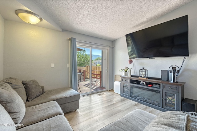 11050 Zeolite Dr, Reno, NV 89506 - living area with light wood finished floors and a textured ceiling