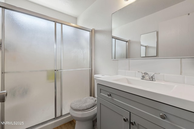 11050 Zeolite Dr, Reno, NV 89506 - bathroom with toilet, vanity, a shower stall, and wood finished floors