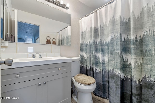 11050 Zeolite Dr, Reno, NV 89506 - bathroom featuring toilet, vanity, and wood finished floors