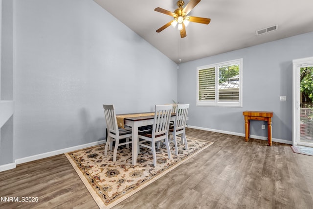 8975 Sorcha St, Reno, NV 89506 - dining room with wood finished floors, ceiling fan, vaulted ceiling, and baseboards