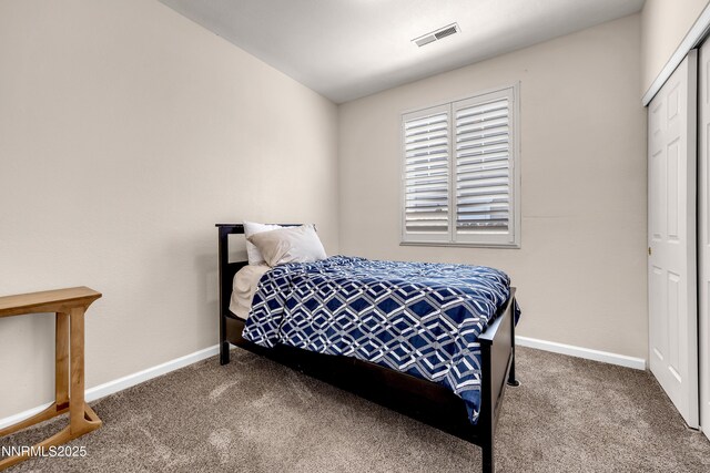 8975 Sorcha St, Reno, NV 89506 - carpeted bedroom featuring baseboards and a closet