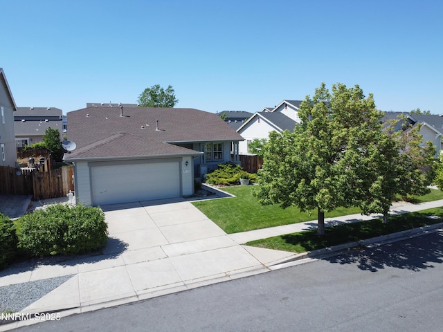 8975 Sorcha St, Reno, NV 89506 - view of front of house with a garage, concrete driveway, roof with shingles, and a residential view