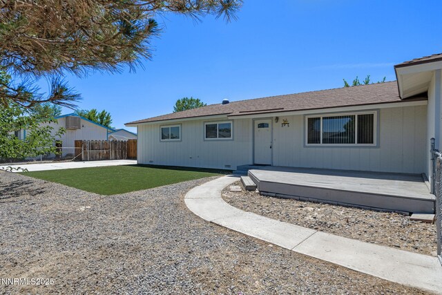 295 Sandia Dr, Fernley, NV 89408 - view of front facade featuring a wooden deck and a patio area